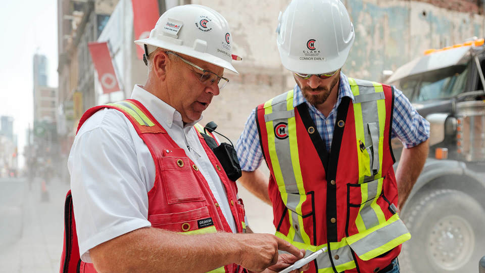 Contractors using a tablet on site